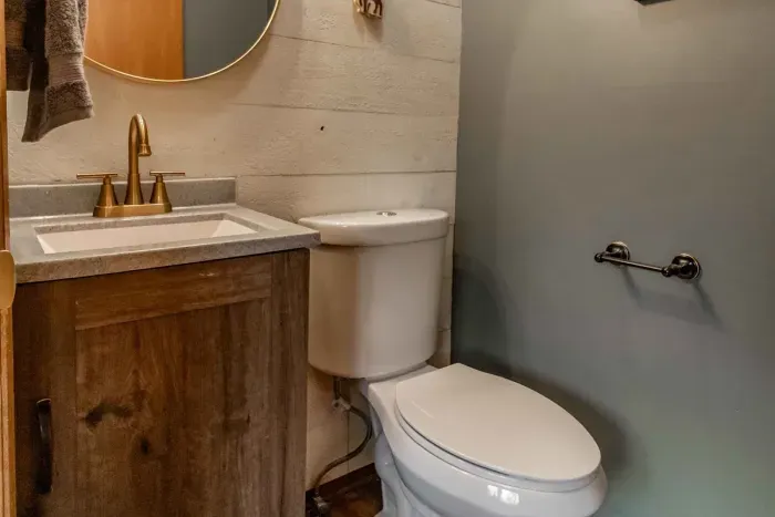 Modern and efficient—everything you need to create a delicious meal. The kitchen features a stainless steel refrigerator, stove, coffee maker, kitchenette oven, kettle, and blender