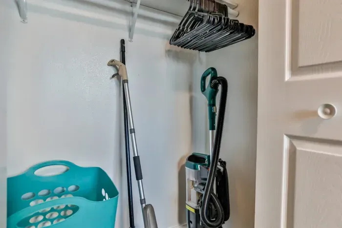 Well-stocked and convenient—our cleaning closet is equipped with everything you need to keep the space tidy and organized.