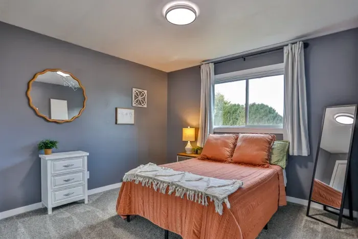 Luxurious master bedroom with a full-size bed for ultimate comfort