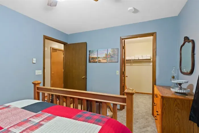 Sleek furniture meets natural textures, with polished wooden accents on the floor adding depth to the minimalist design.