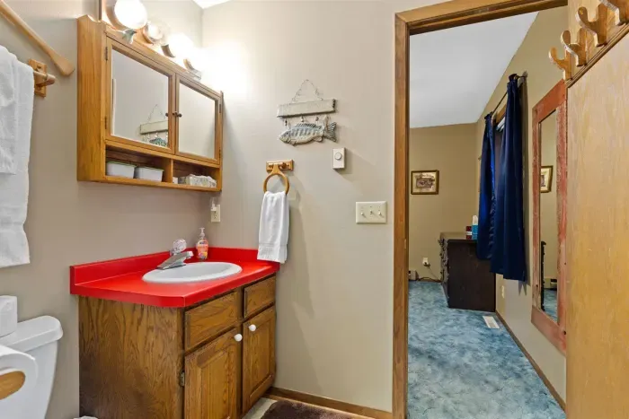 A bright and well-kept bathroom with ample counter space, storage, and fresh lighting for daily comfort. Thoughtfully equipped with essentials for a convenient and relaxing stay.