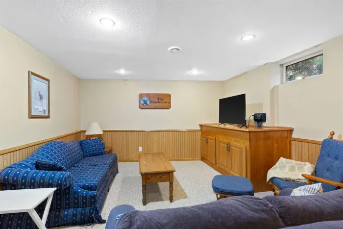 Enjoy this bright and welcoming living area with plush seating, a dining table, and entertainment space. Designed for laid-back evenings, conversation, or casual meals together.