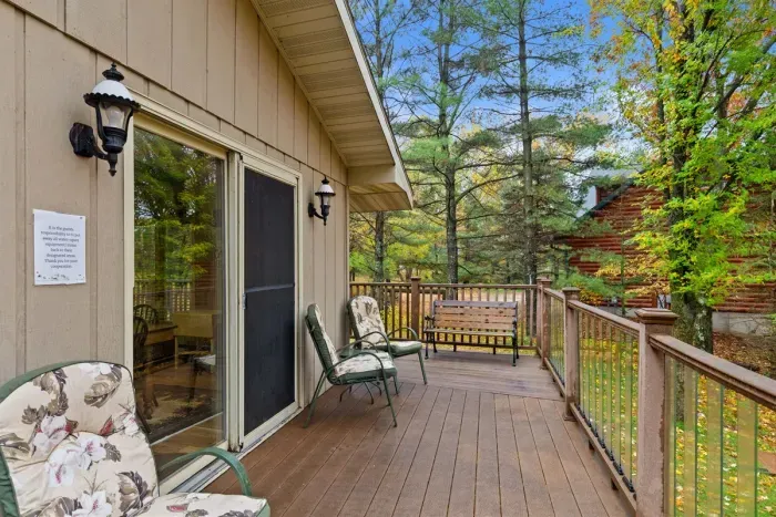 Cozy fall retreat with outdoor seating and panoramic tree views