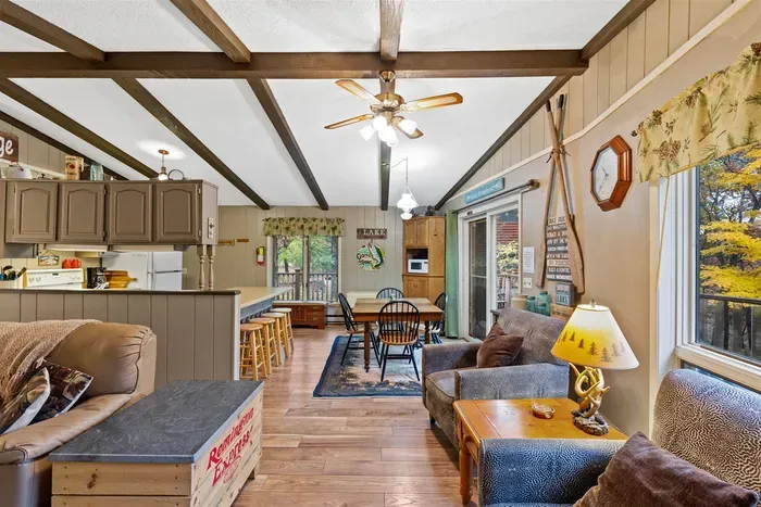 Dining area visible off the living space with lake view.
