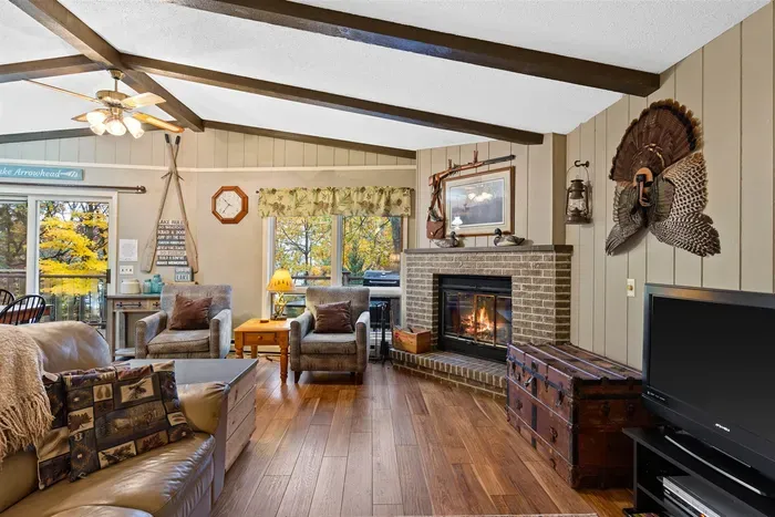 Cozy lakeside cabin living room with warm fireplace.