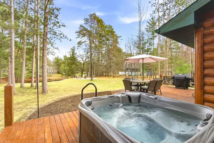 Enjoy a cozy soak in the outdoor hot tub after a long day of exploring.
