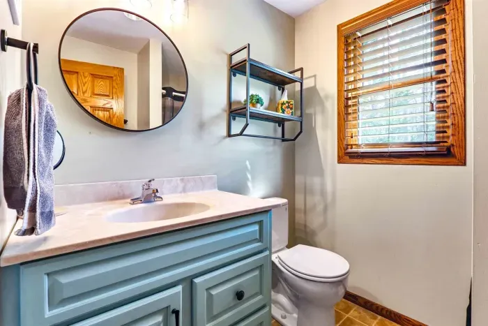 Bright, spotless bathroom designed for comfort and convenience.