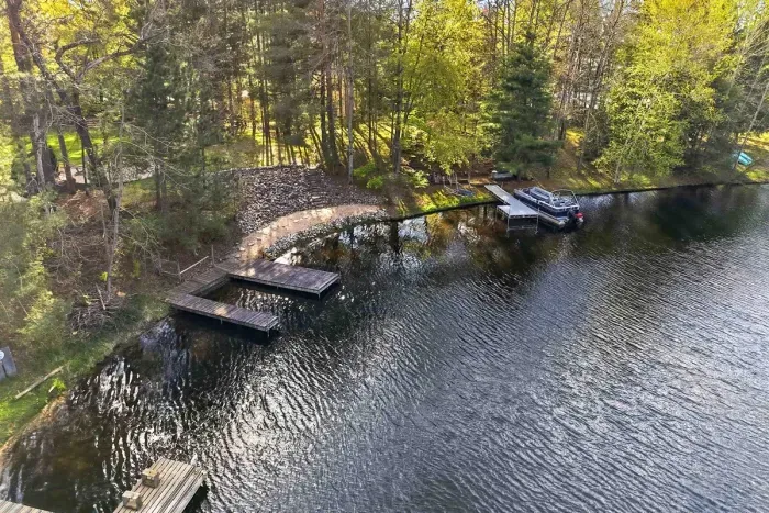 From morning swims to sunset dockside relaxing, this wooded waterfront setting is made for effortless living.