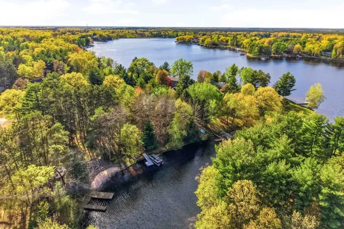 Escape to wide-open lake views, tucked among the trees with private water access and endless Up North scenery all around.