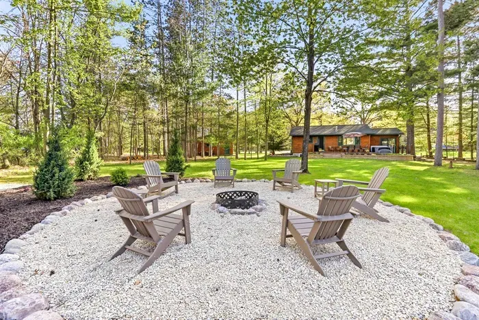 A peaceful outdoor setting made for evening fires, relaxed conversations, and quiet cabin-country living.