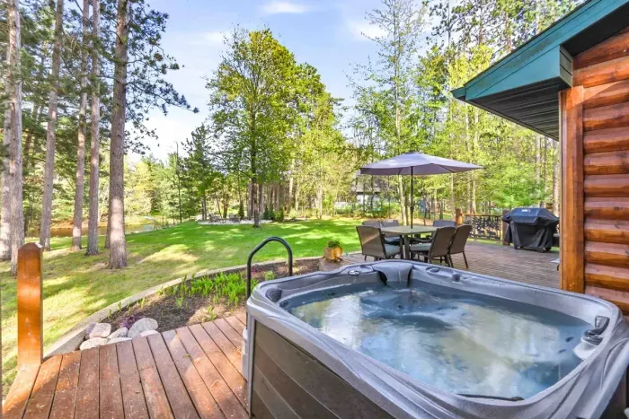 A private deck retreat with hot tub, grilling space, and room to gather after long days by the lake.