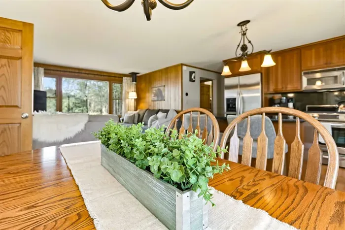 Inviting dining table and kitchen for shared meals and comfort.