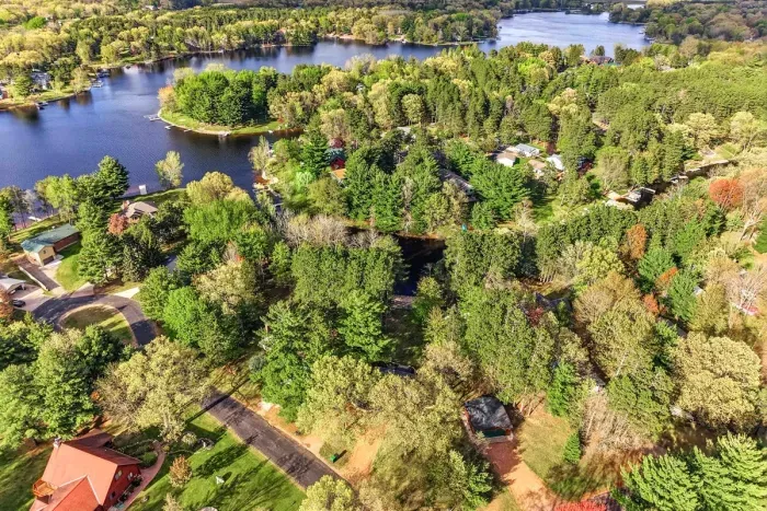 Surrounded by sparkling lakes and endless trees, this peaceful retreat offers the feeling of a private Up North escape with water, woods, and relaxation all around.
