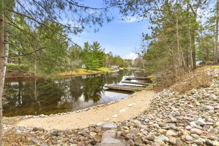 Peaceful waterfront views with private dock and natural surroundings.