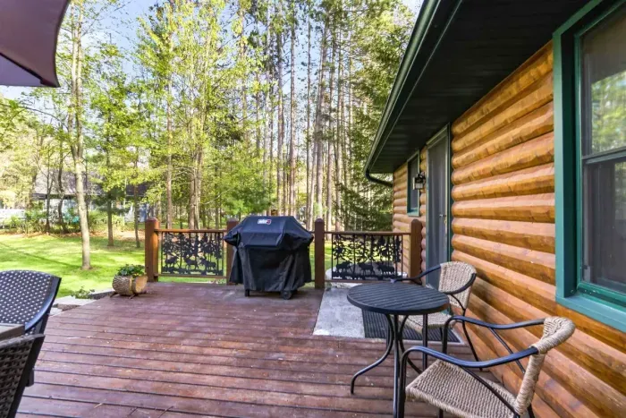 Enjoy morning coffee or sunset dinners from the deck, surrounded by trees and just steps from the shoreline.