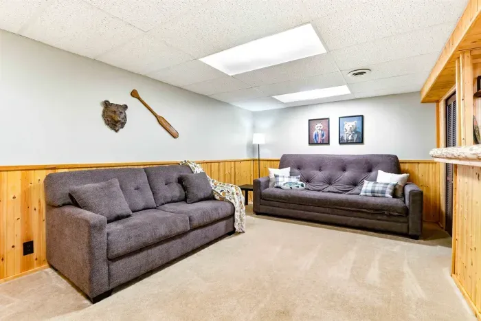 Cozy entertainment area featuring a private bar and lounge seating.