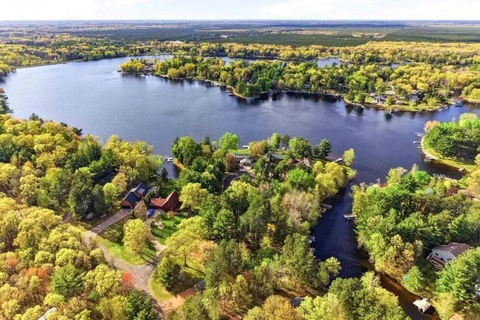 Wake up surrounded by shimmering water, winding shorelines, and endless treetop views—an inviting lakeside escape made for relaxed days.