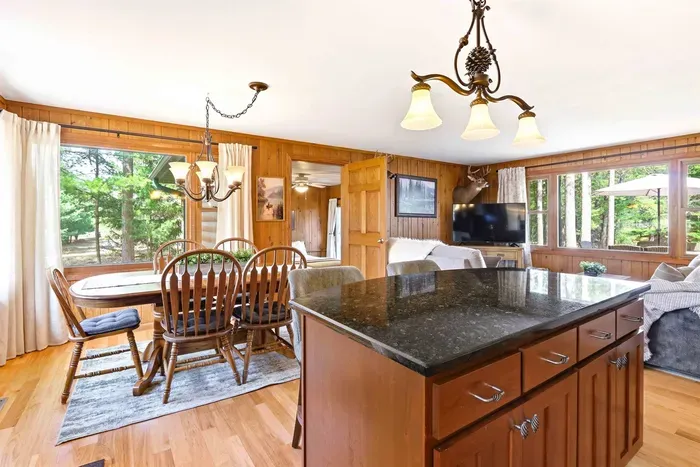 Modern kitchen and dining area perfect for cooking and gathering.