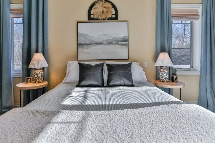 The bedroom combines modern design with warm lighting to create a welcoming, comfortable retreat.