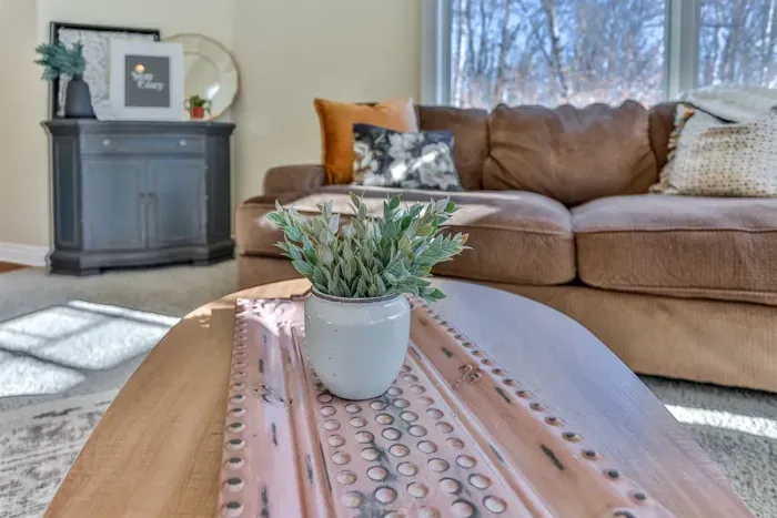 The shared living room features a mini table for drinks or snacks.