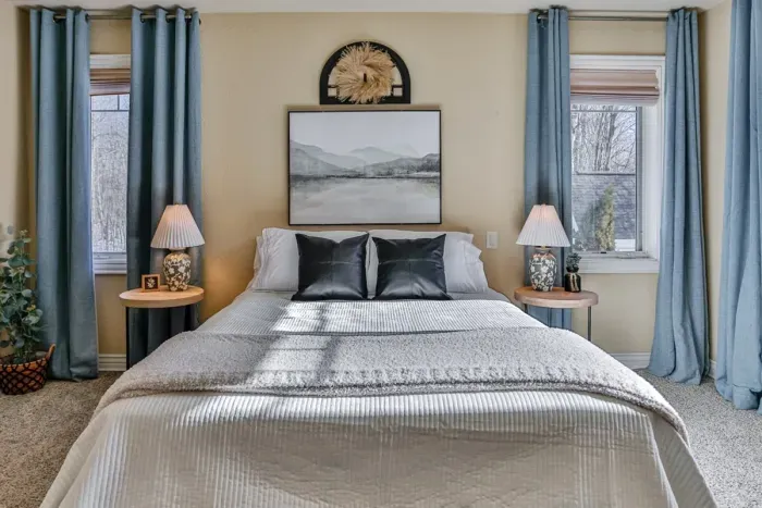 A sleek, modern bedroom featuring soft, warm lighting that adds comfort and ambiance to the space.