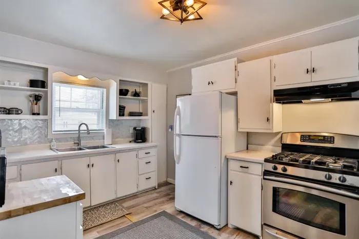 Charming kitchen with modern appliances, generous storage, and a bright, inviting layout.