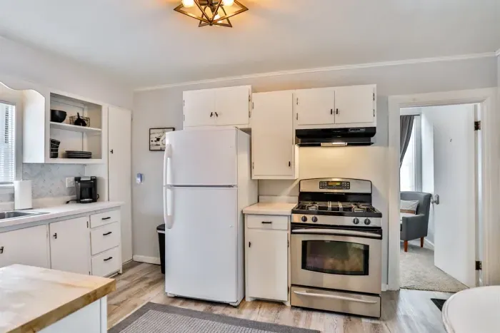 A cozy, well-lit kitchen with modern appliances and easy access to the living area.