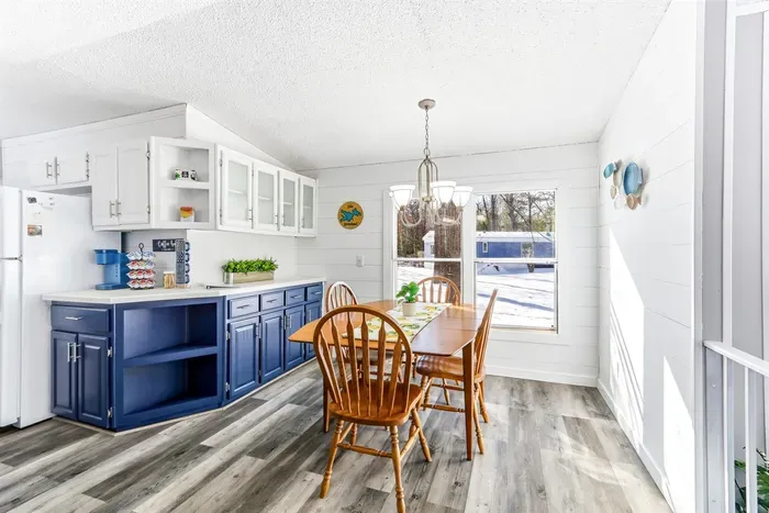 Contemporary kitchen with stylish cabinetry and a dining area, ideal for cooking and sharing meals.