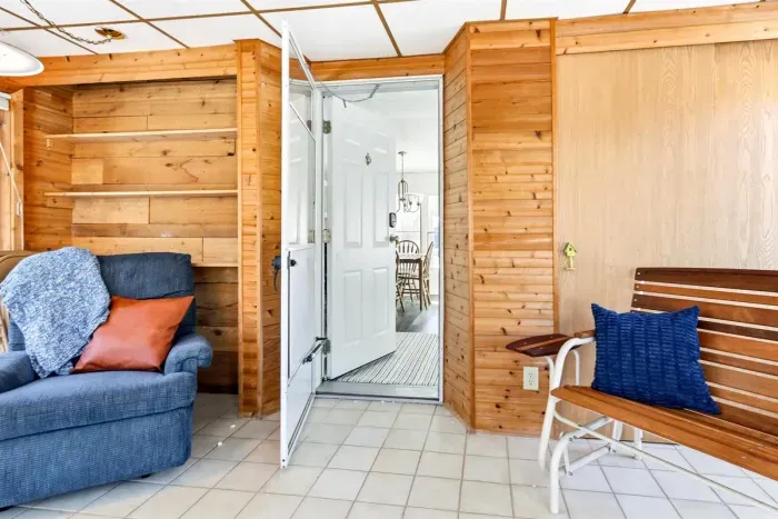 Step outside easily through the screened door, or cozy up inside and soak in the peaceful, airy atmosphere of this charming retreat.