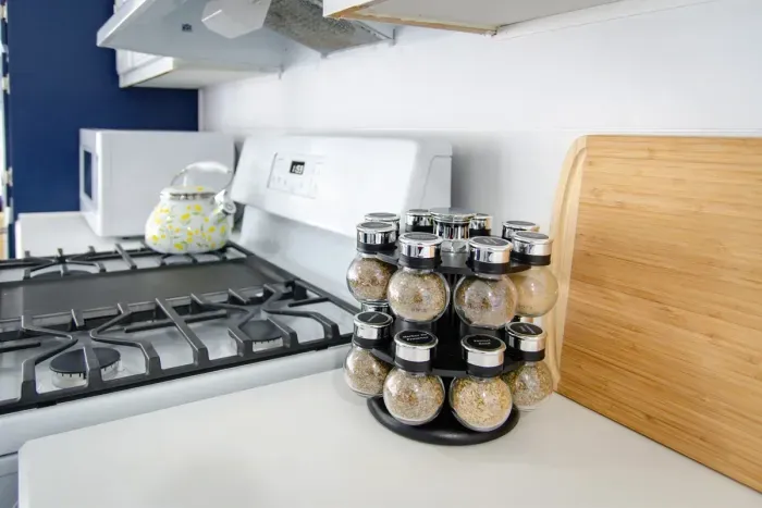 Modern stove with handy condiments, ready for your meals.