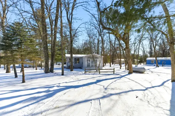 Surrounded by a winter wonderland in the colder months, with beautiful snow-covered trees.