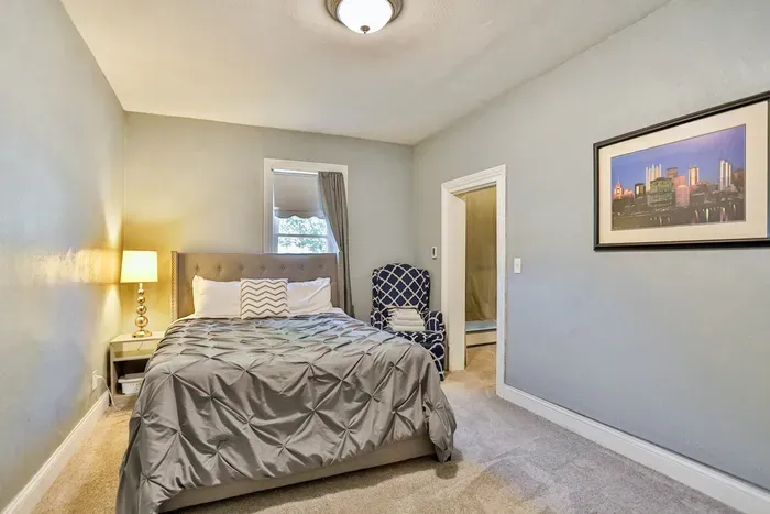 Rest easy in this cozy bedroom with a queen bed, designed for a comfortable and relaxing stay.