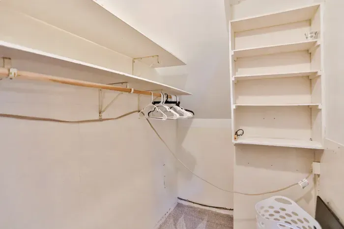Enjoy added convenience with a spacious walk-in closet with hangers and shelving for easy unpacking.