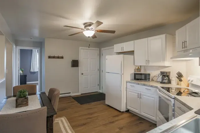 Fully equipped kitchen with stainless steel appliances, perfect for cooking homemade meals during your stay. Enjoy the convenience of a coffee maker, microwave, and a large refrigerator.