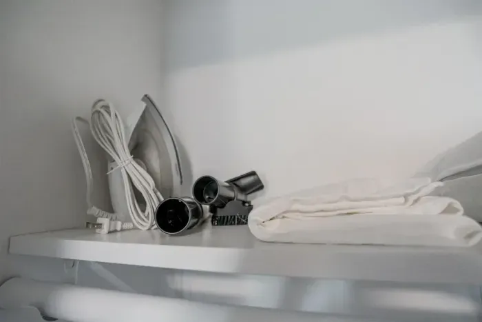 Spacious closet with shelves and hangers, offering ample room for your clothing and belongings, perfect for an organized stay.