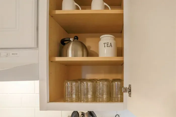 Fully equipped kitchen with stainless steel appliances, perfect for cooking homemade meals during your stay. Enjoy the convenience of a coffee maker, microwave, and a large refrigerator.