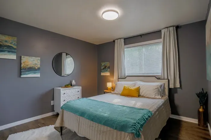 Spacious and bright bedroom with a plush queen-sized bed, luxury linens, and a peaceful atmosphere to guarantee a restful sleep during your stay.