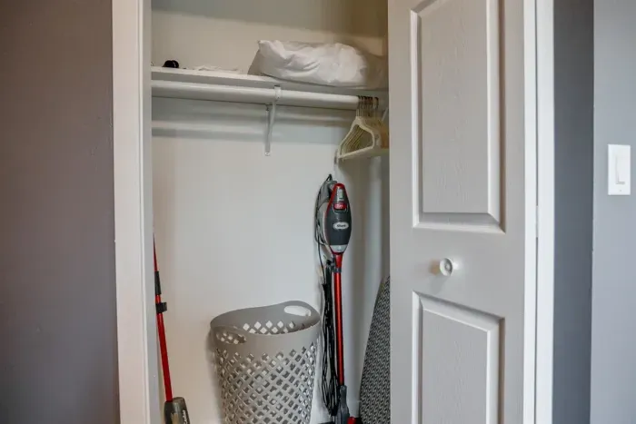 Spacious closet with shelves and hangers, offering ample room for your clothing and belongings, perfect for an organized stay.