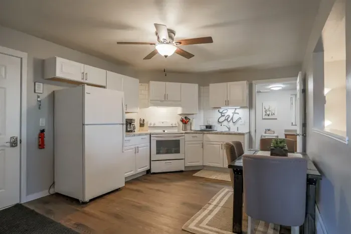 Fully equipped kitchen with stainless steel appliances, perfect for cooking homemade meals during your stay. Enjoy the convenience of a coffee maker, microwave, and a large refrigerator.