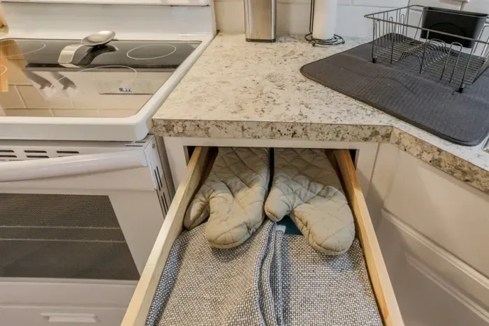 Fully equipped kitchen with stainless steel appliances, perfect for cooking homemade meals during your stay. Enjoy the convenience of a coffee maker, microwave, and a large refrigerator.