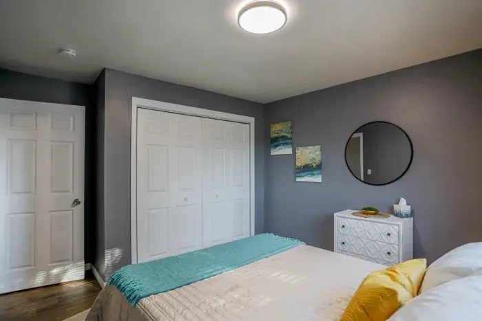 Spacious and bright bedroom with a plush queen-sized bed, luxury linens, and a peaceful atmosphere to guarantee a restful sleep during your stay.