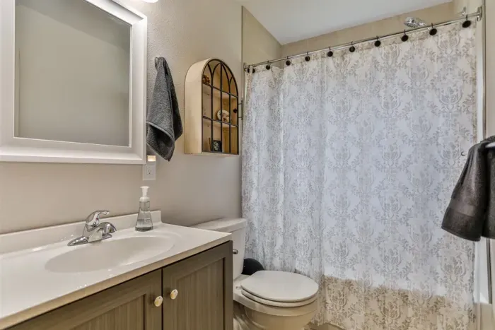Clean, modern bathroom with fresh towels and essential amenities.