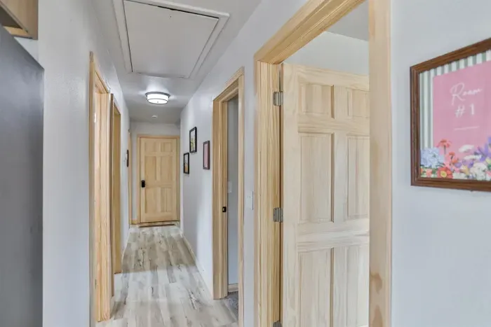 Simple, well-lit hallway with a neat and modern look.
