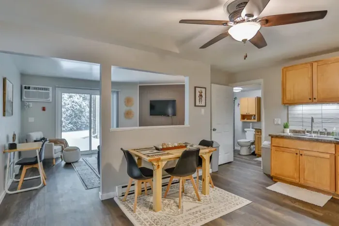 Stylish and efficient—equipped with everything you need to prepare a delicious meal. Features include a stainless steel refrigerator, stove, coffee maker, kitchenette oven, and a cozy eating area.