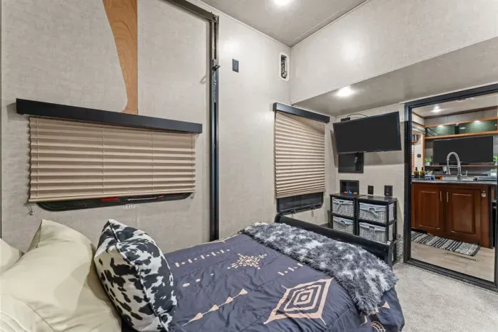 Comfortable twin bed with TV for a restful stay.