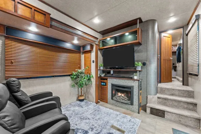 Comfortable lounge area inside the bunkhouse camper, ideal for unwinding after arena events.