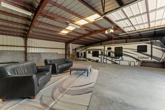 Relax on the outdoor couch seating area inside the shop - perfect for unwinding between rodeo events.