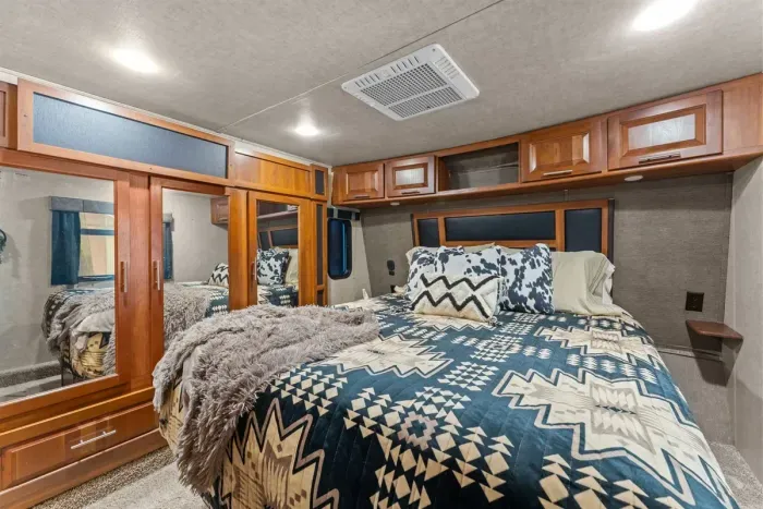 Comfortable queen bedroom designed for restful nights after rodeo events.