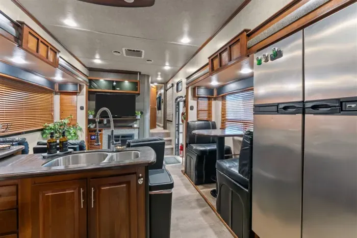 Fully equipped camper kitchen with full-size appliances for easy home-cooked meals.