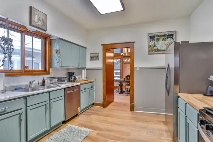 Bright, fully equipped kitchen with charming vintage details, updated appliances, and plenty of counter space.